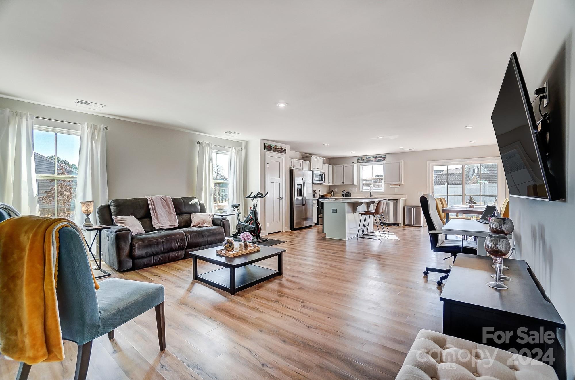 4136 Mackinnon Drive Charlotte, NC 28214 - Photo 5 of 48 a living room with fireplace furniture and a flat screen tv