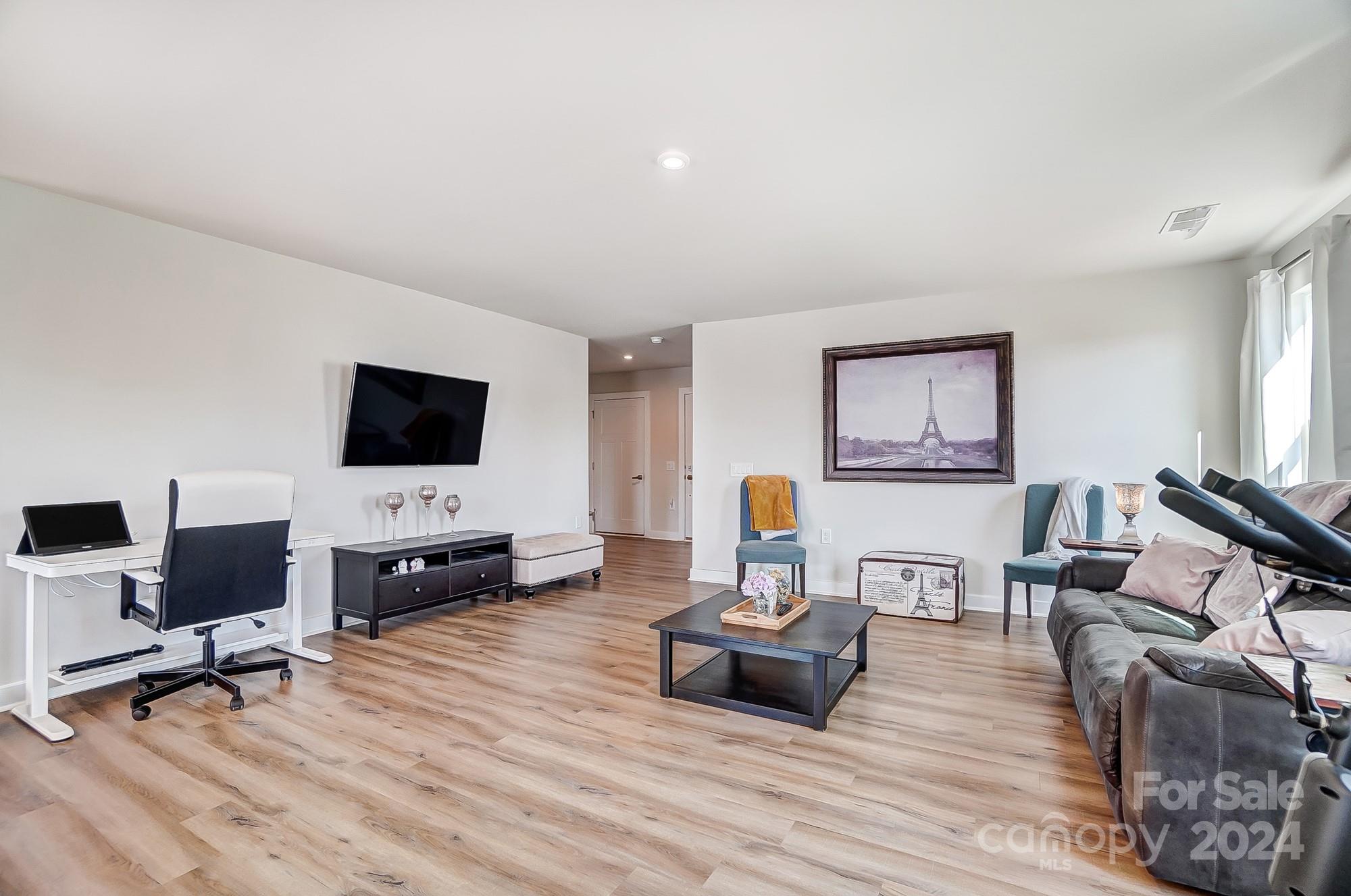 4136 Mackinnon Drive Charlotte, NC 28214 - Photo 7 of 48 a living room with furniture and a flat screen tv