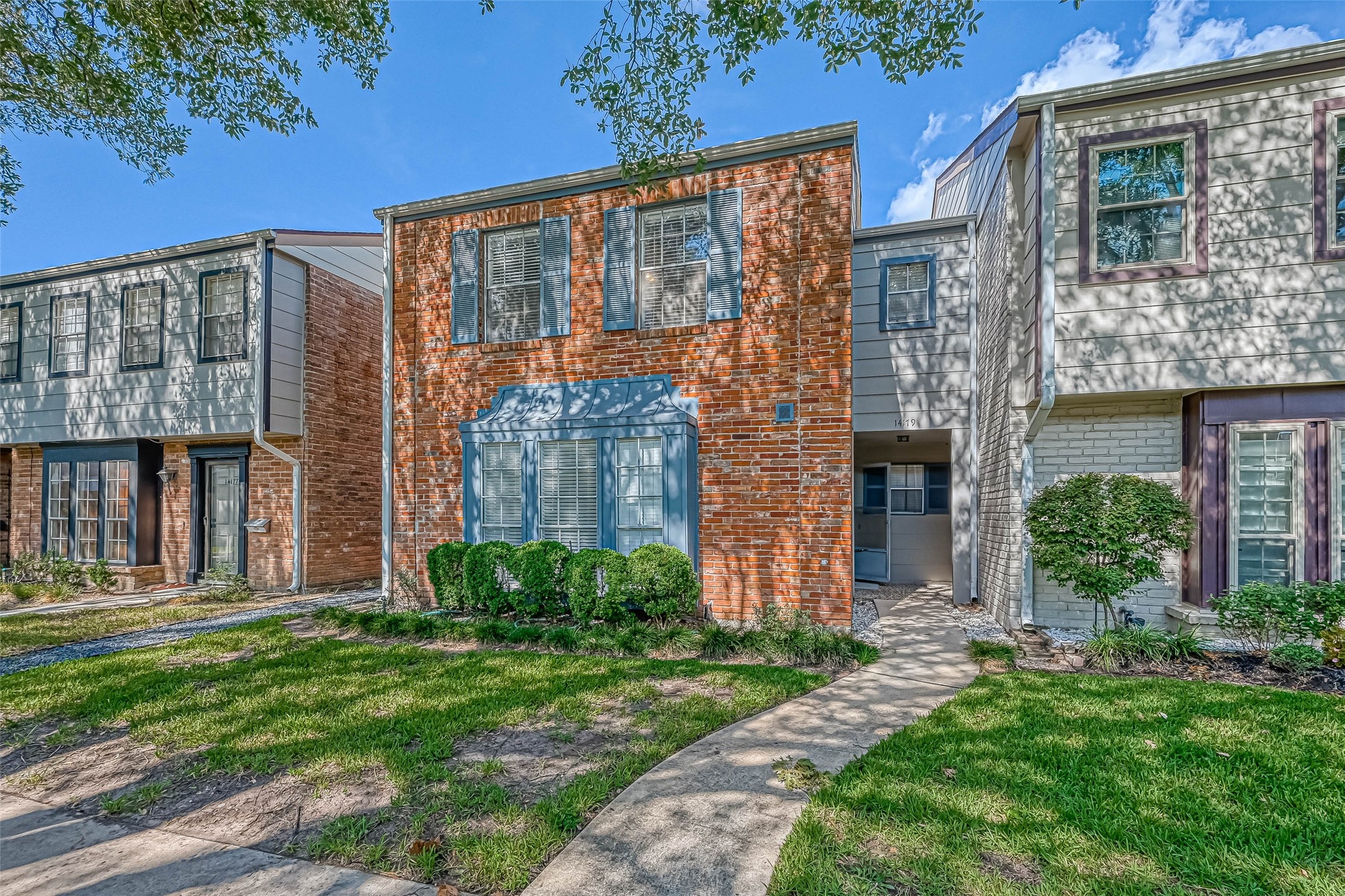 14179 Misty Meadow Lane Houston, TX 77079 - Photo 5 of 41 front view of a brick house with a yard