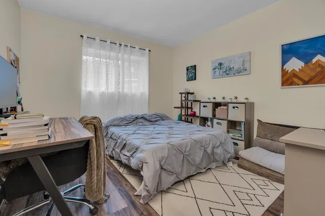 a bedroom with a bed and a table in it