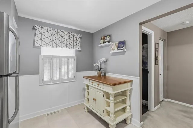 a spacious bathroom with a sink a mirror and a window