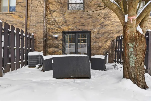 a view of a terrace with chairs and a fire pit