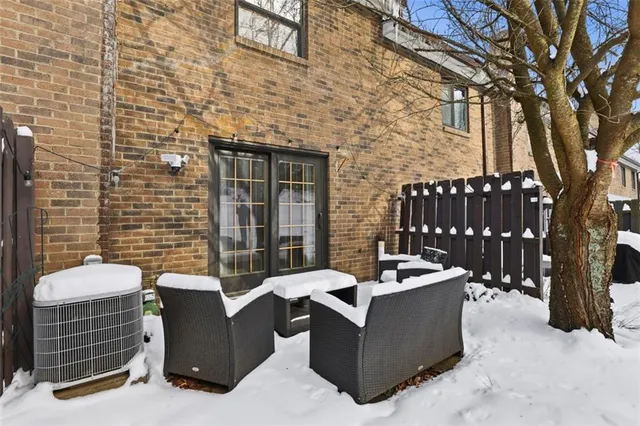 a view of a patio with couches chairs and a fire pit