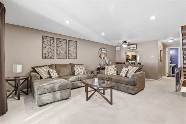 a living room with furniture and a table