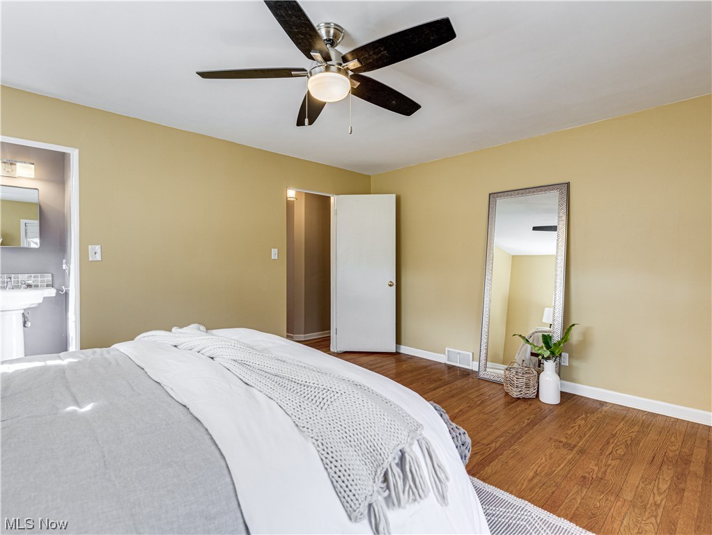2425 Amesbury Road Akron, OH 44313 - Photo 15 of 42 Bedroom with dark hardwood / wood-style flooring and ceiling fan