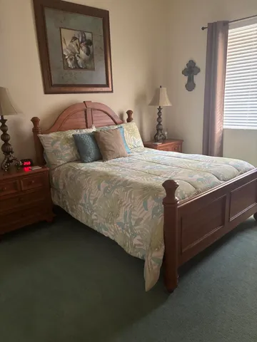 a bedroom with a bed and window