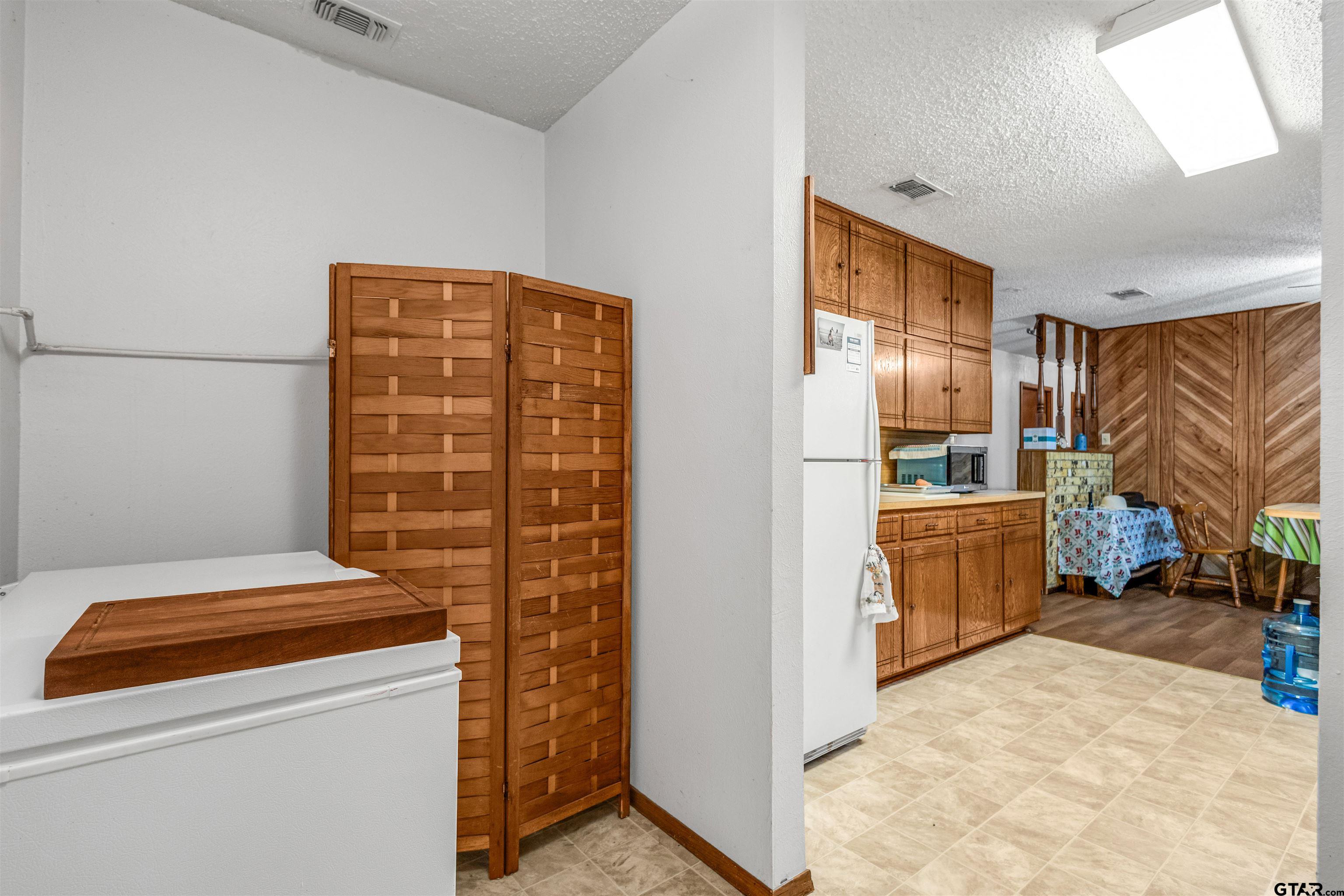 3702 E Highway Quitman, TX 75783 - Photo 15 of 33 a room with storage and utility