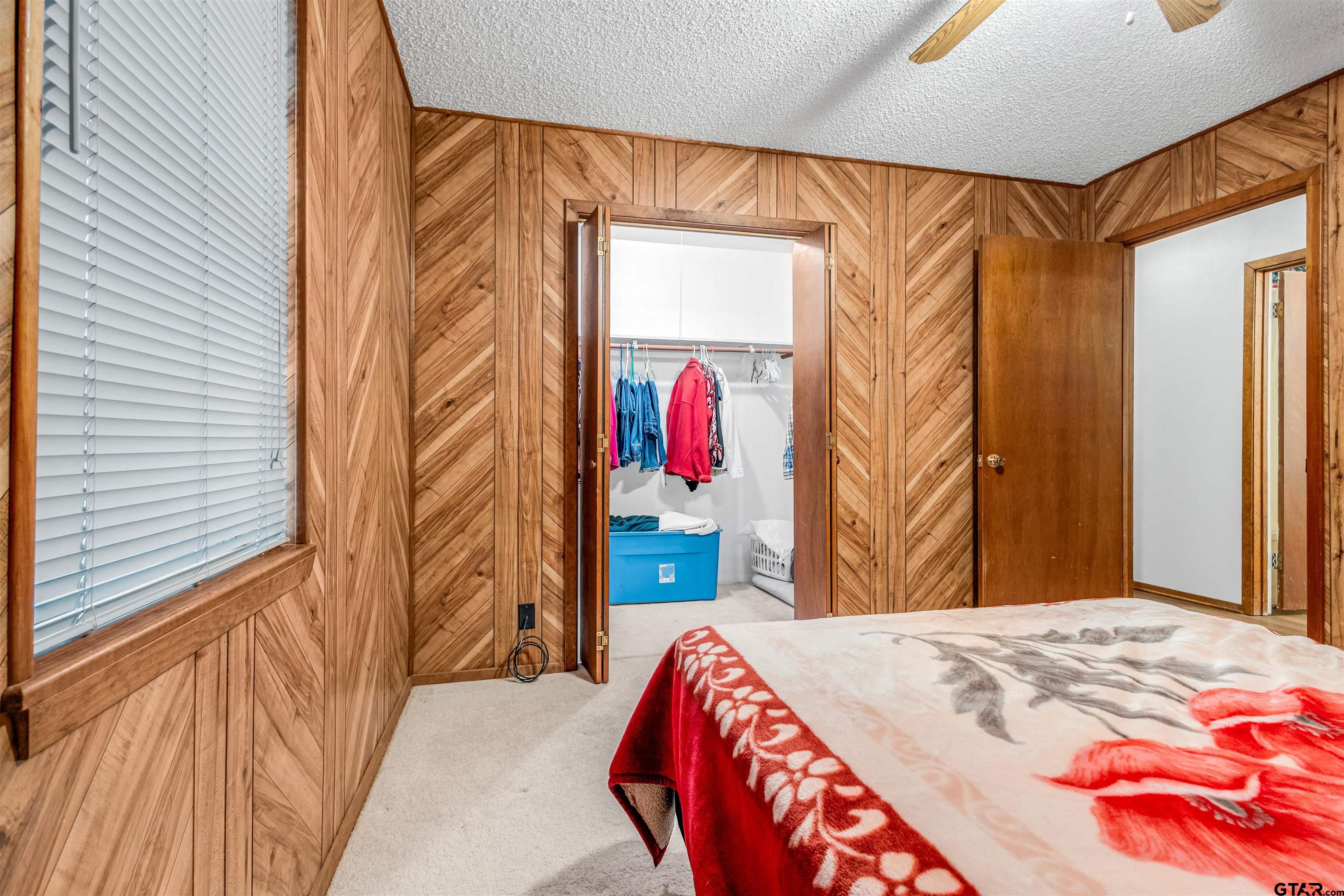 3702 E Highway Quitman, TX 75783 - Photo 21 of 33 a bedroom with a bed and a painting on the wall