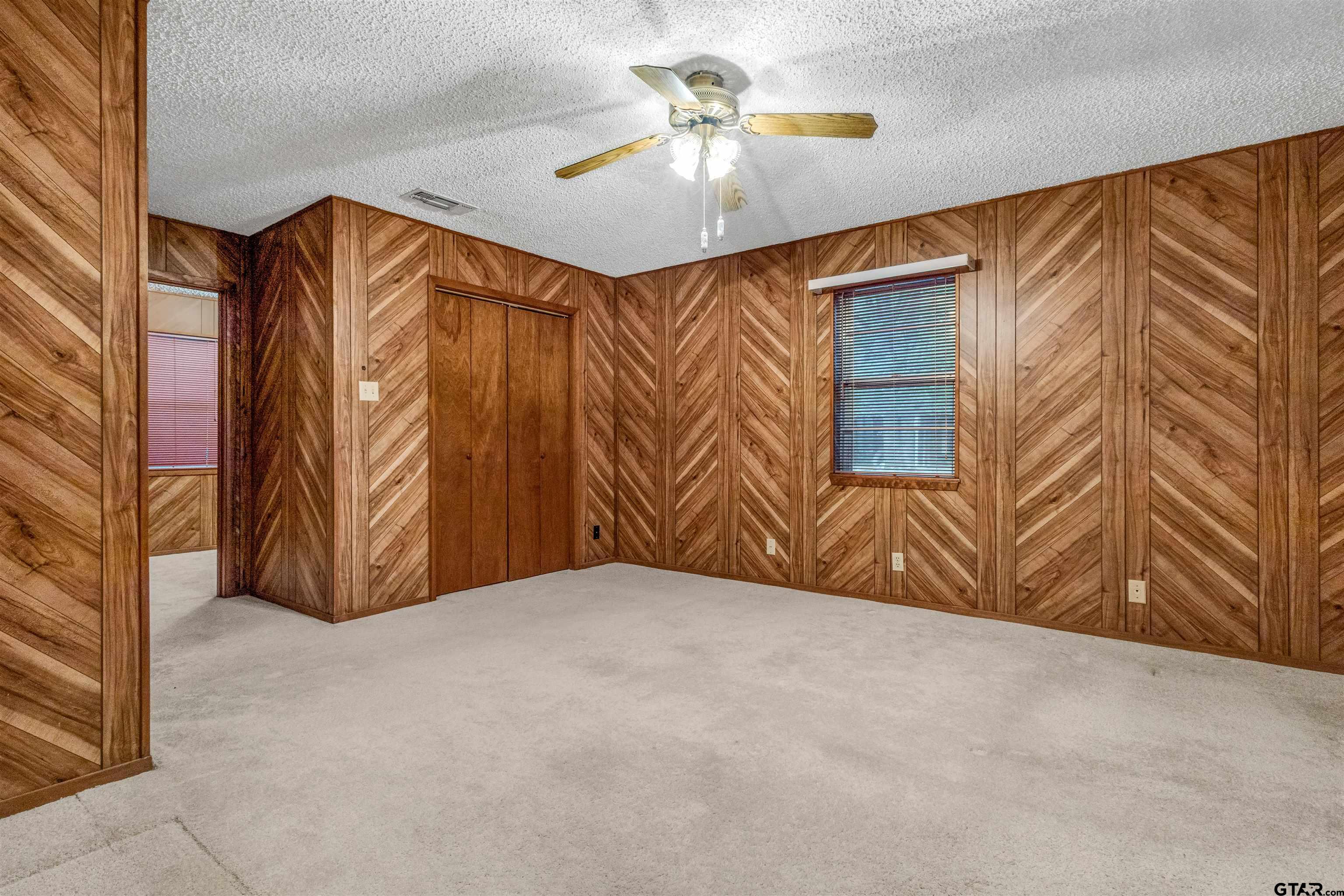 3702 E Highway Quitman, TX 75783 - Photo 26 of 33 a view of a livingroom with a ceiling fan and a window
