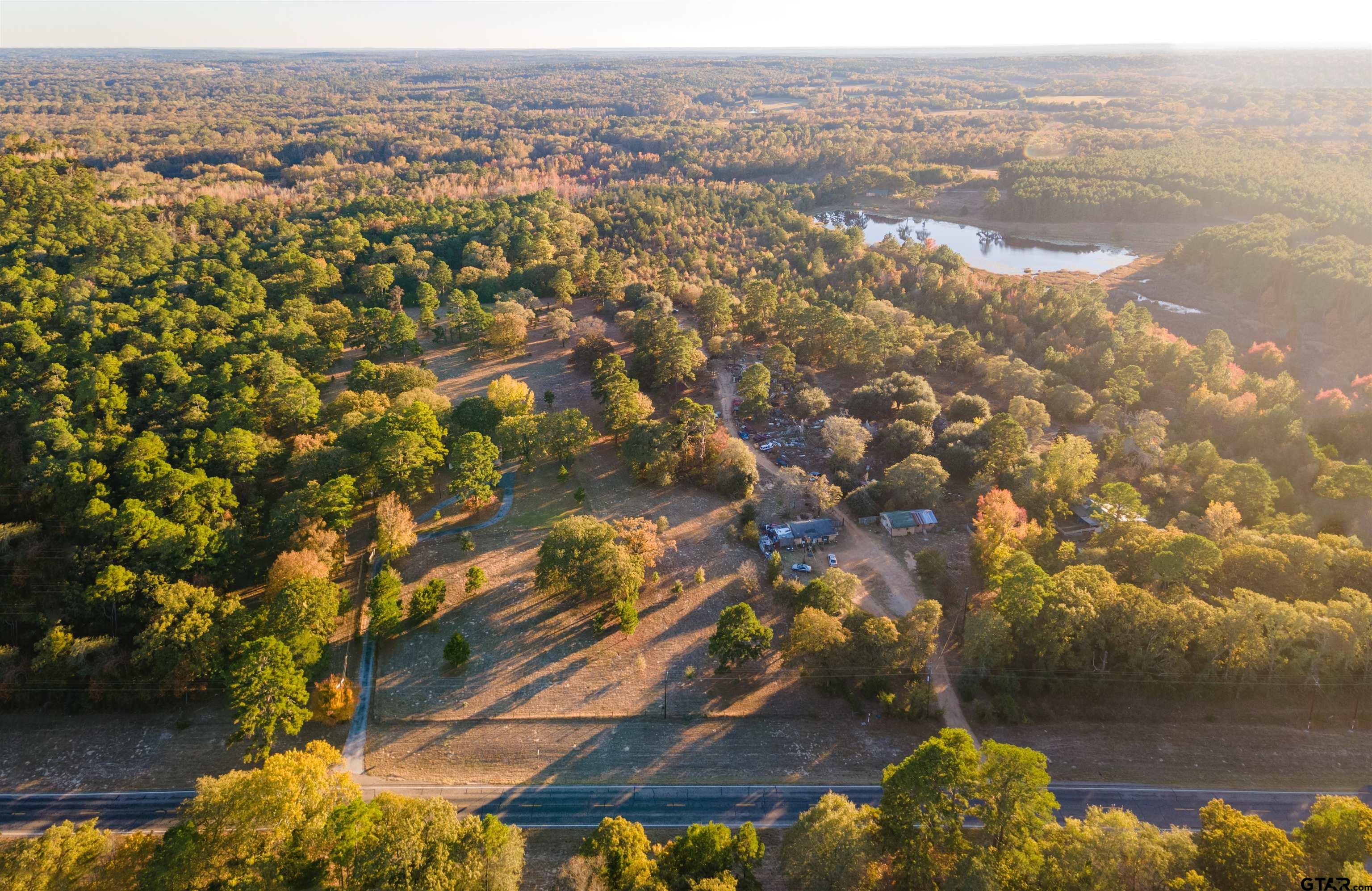 3702 E Highway Quitman, TX 75783 - Photo 32 of 33 an aerial view of residential building and lake