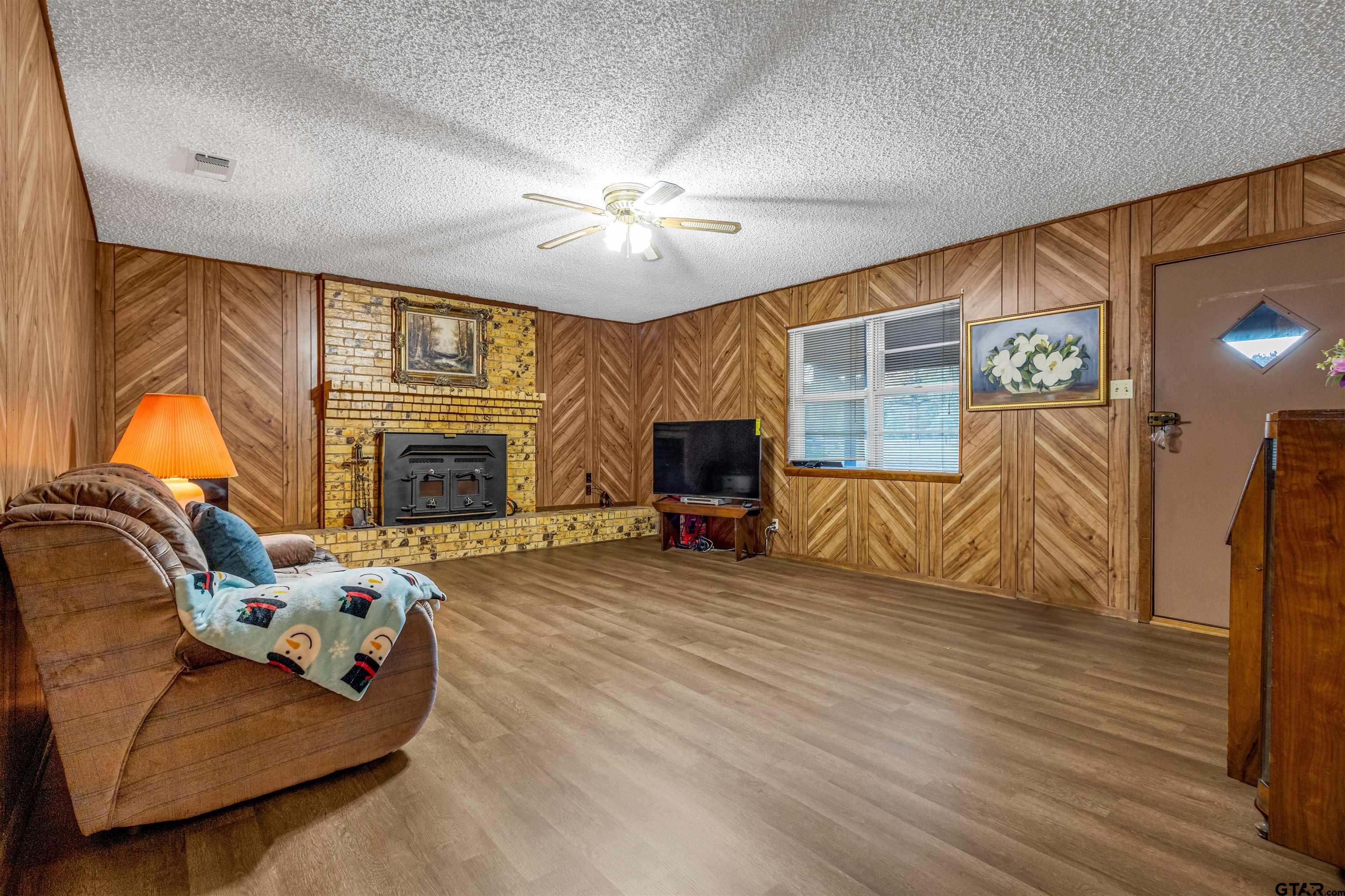 3702 E Highway Quitman, TX 75783 - Photo 8 of 33 a living room with furniture and a fireplace
