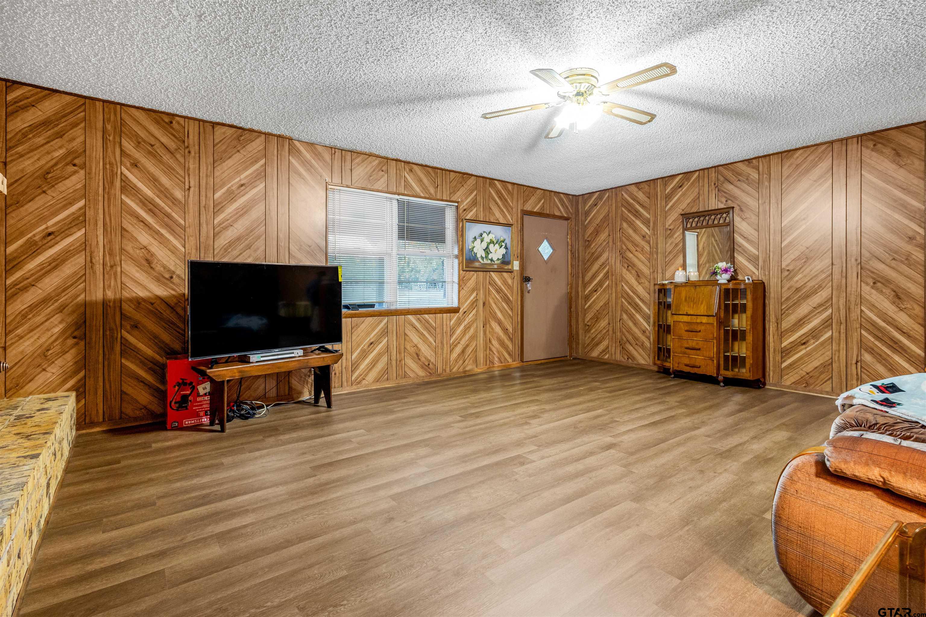 3702 E Highway Quitman, TX 75783 - Photo 10 of 33 a living room with furniture and a flat screen tv