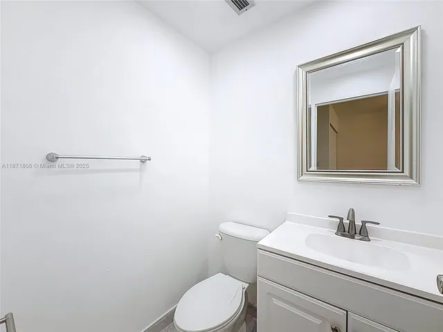 a view of walk in closet with wooden floor