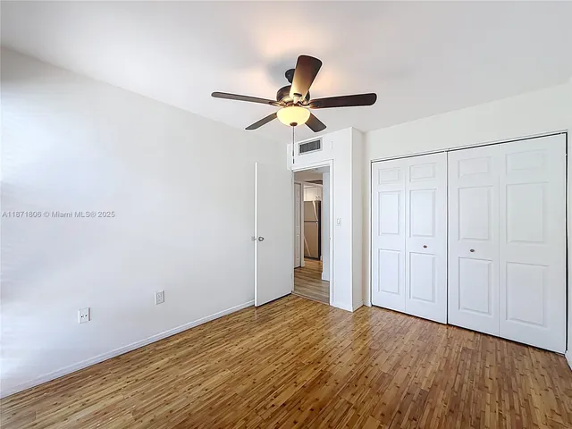 a view of a big room with wooden floor in closet