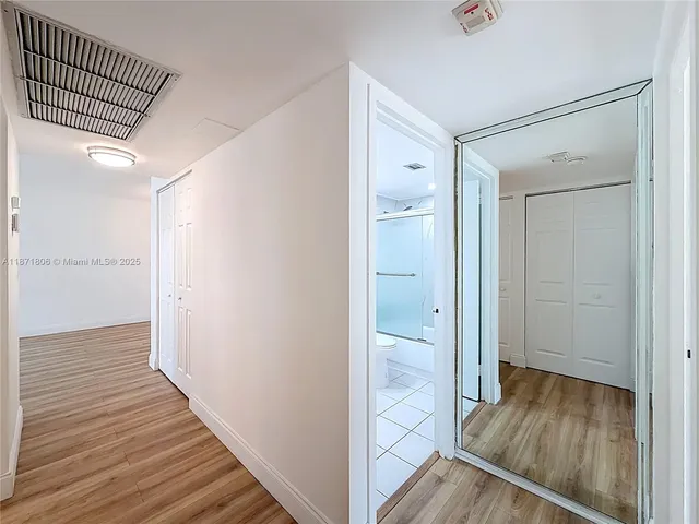 a view of a building with a backyard and a patio