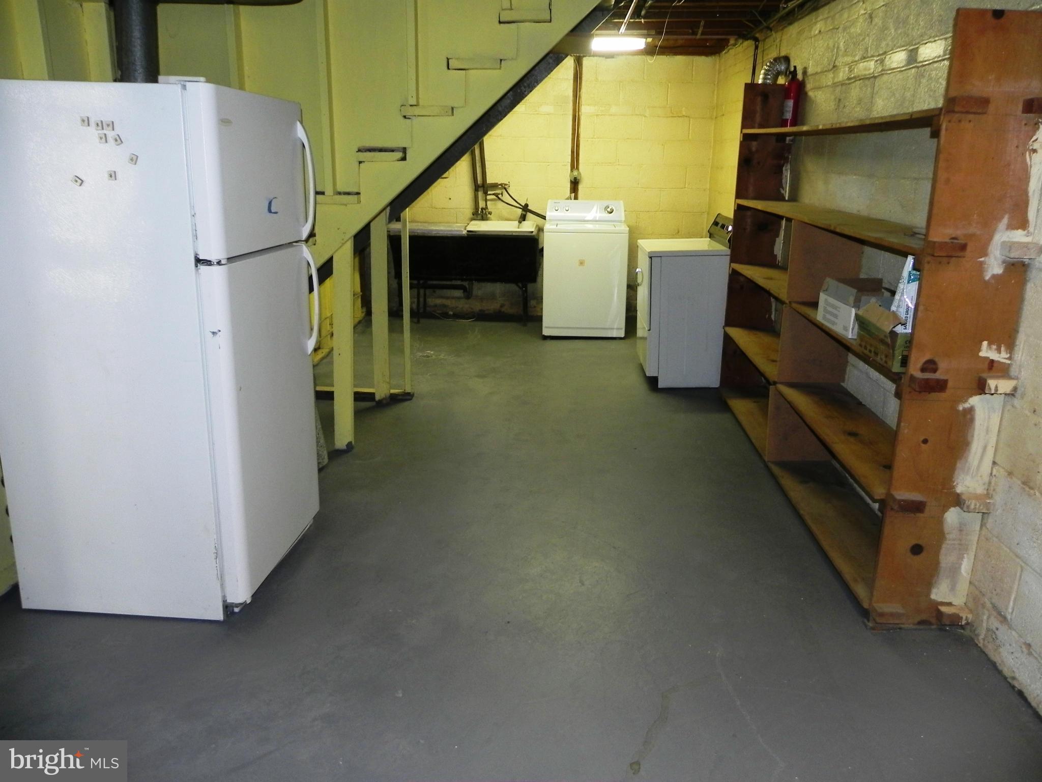 10212 Brunswick Avenue Silver Spring, MD 20902 - Photo 25 of 28 Laundry room with extra fridge
