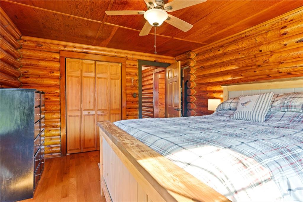 121 Jackson Street Harmony, PA 16037 - Photo 19 of 50 a bedroom with a bed and a chandelier