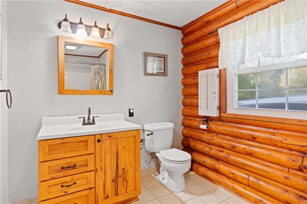 121 Jackson Street Harmony, PA 16037 - Photo 24 of 50 a bathroom with a sink a toilet and a bathtub
