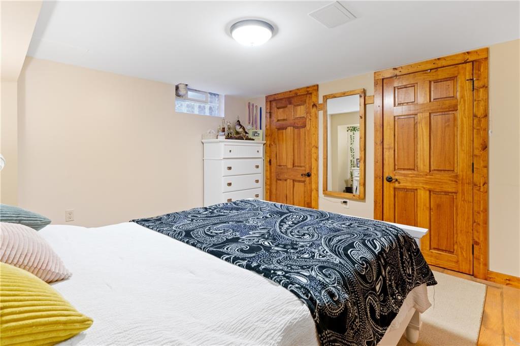 121 Jackson Street Harmony, PA 16037 - Photo 27 of 50 a bedroom with a bed and cabinets