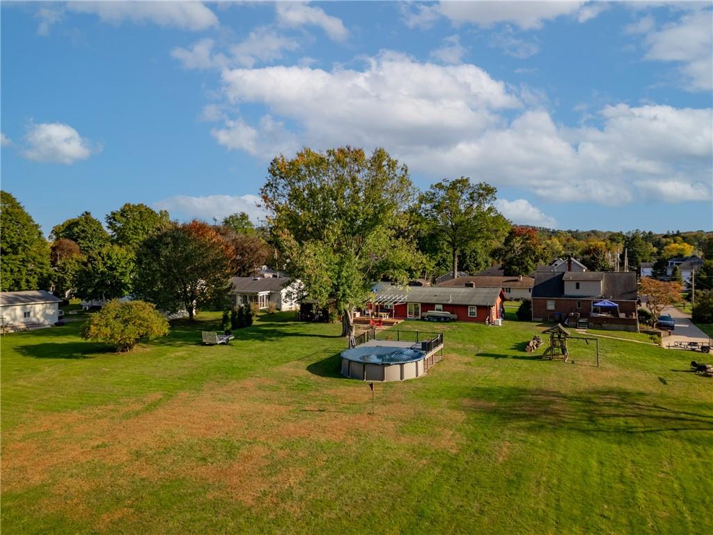 121 Jackson Street Harmony, PA 16037 - Photo 37 of 50 a view of a house with swimming pool and garden