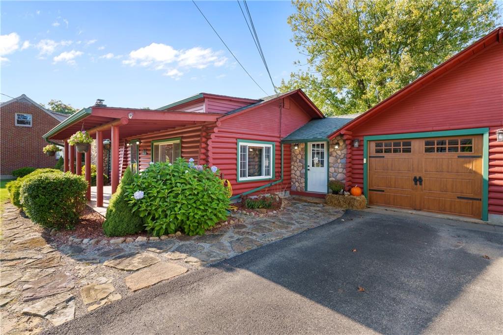 121 Jackson Street Harmony, PA 16037 - Photo 48 of 50 a front view of a house with a garden