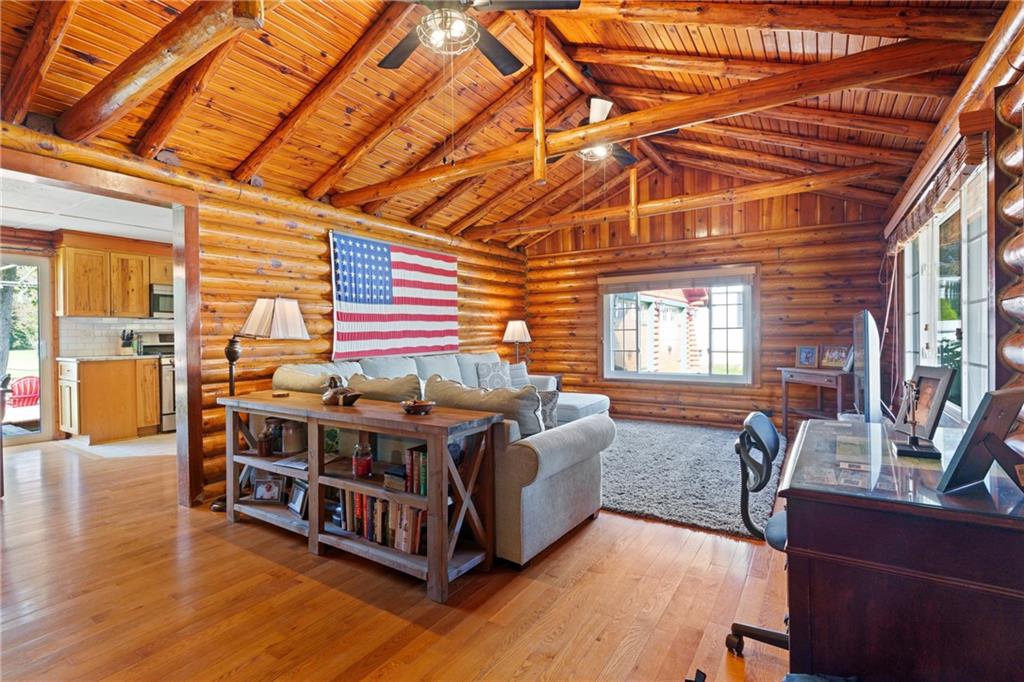 121 Jackson Street Harmony, PA 16037 - Photo 7 of 50 a spacious bedroom with a bed and wooden floors