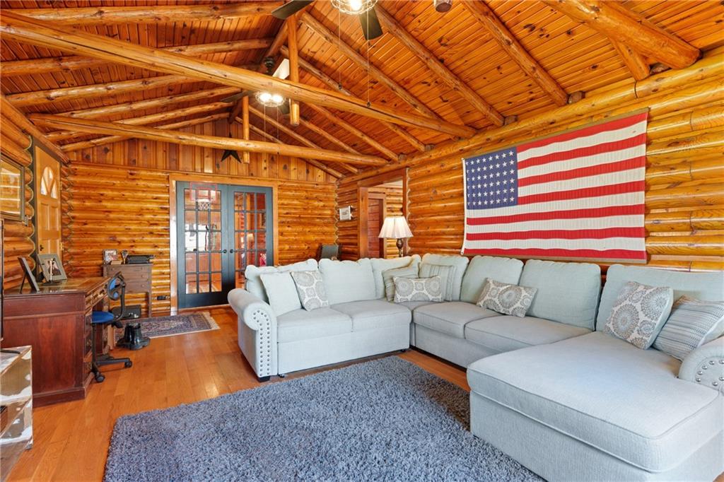 121 Jackson Street Harmony, PA 16037 - Photo 8 of 50 a living room with furniture and a chandelier