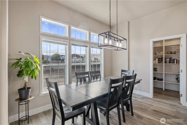 a view of a dining room with furniture window and wooden floor