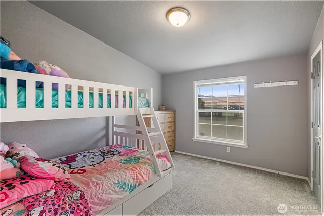 a bedroom with furniture and a window
