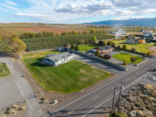 a view of a swimming pool and an outdoor seating