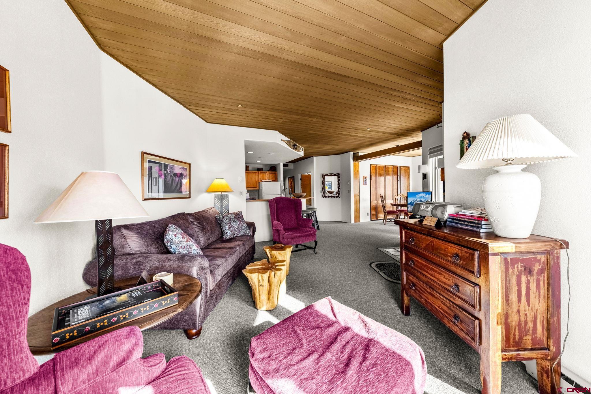 117 Needles Way, Unit 528 Durango, CO 81301 - Photo 21 of 41 a living room with furniture and a wooden floor