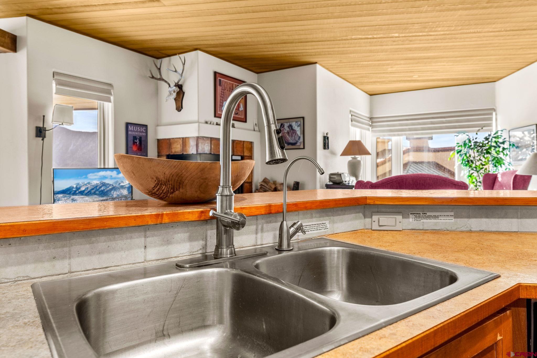 117 Needles Way, Unit 528 Durango, CO 81301 - Photo 27 of 41 a kitchen with a sink and a stove