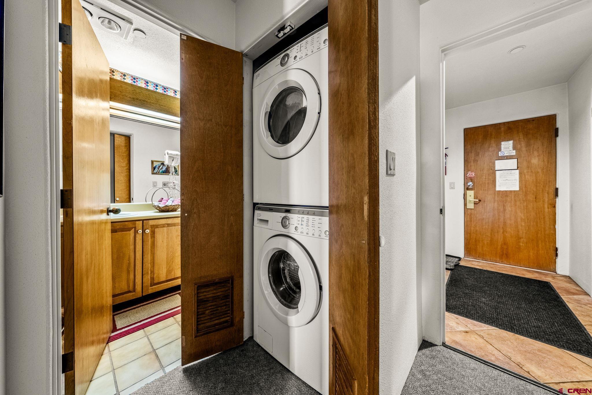 117 Needles Way, Unit 528 Durango, CO 81301 - Photo 39 of 41 a view of a storage and utility room with washer and dryer