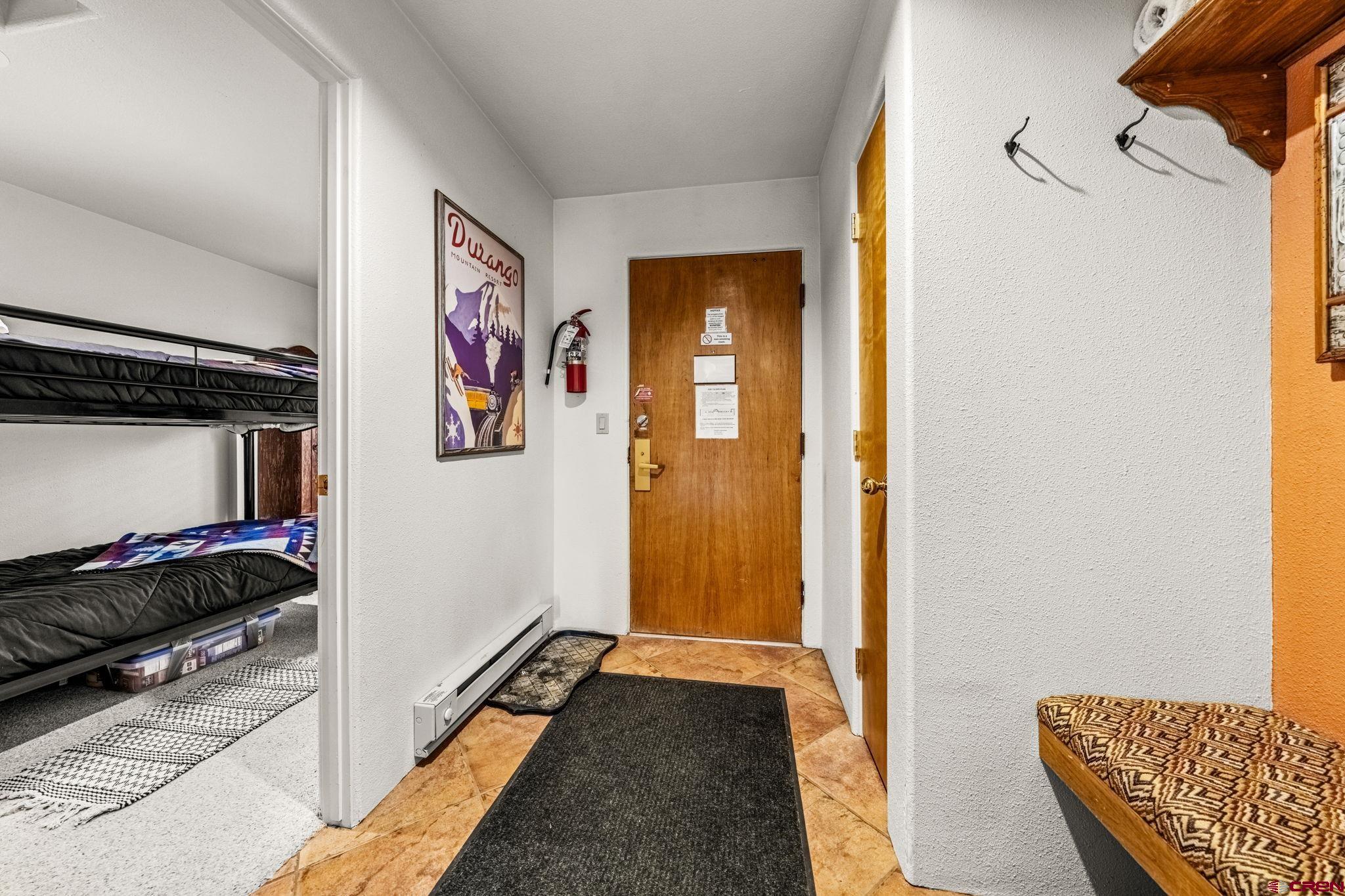 117 Needles Way, Unit 528 Durango, CO 81301 - Photo 4 of 41 a view of a bedroom with a bed and wooden floor