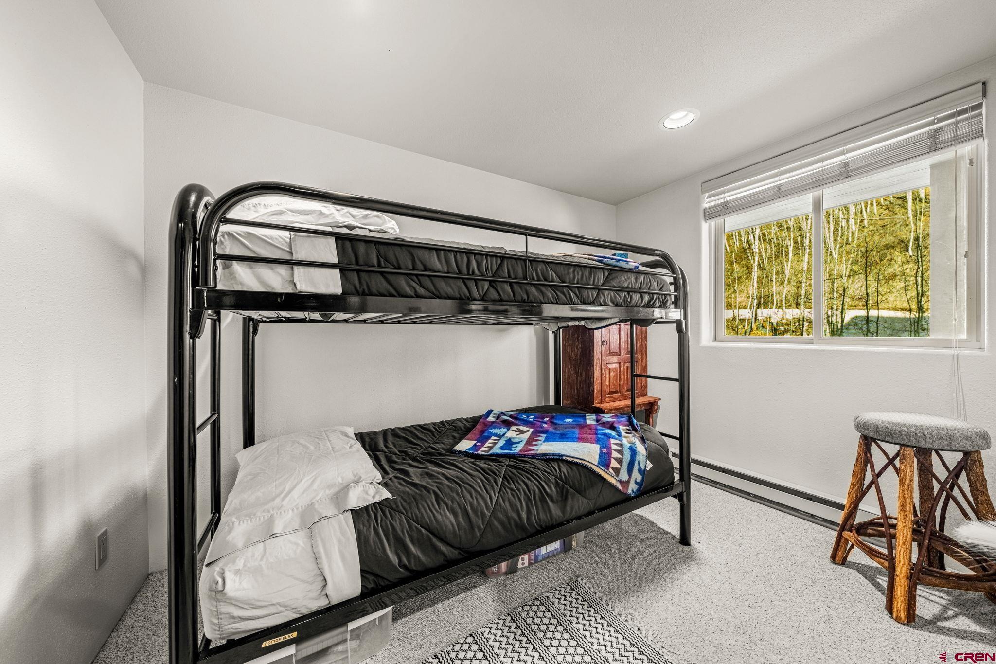 117 Needles Way, Unit 528 Durango, CO 81301 - Photo 5 of 41 a bedroom with a bed and a window