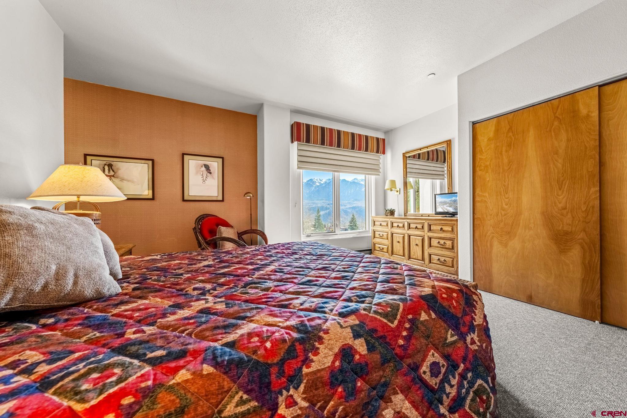 117 Needles Way, Unit 528 Durango, CO 81301 - Photo 7 of 41 a bedroom with a bed and a window