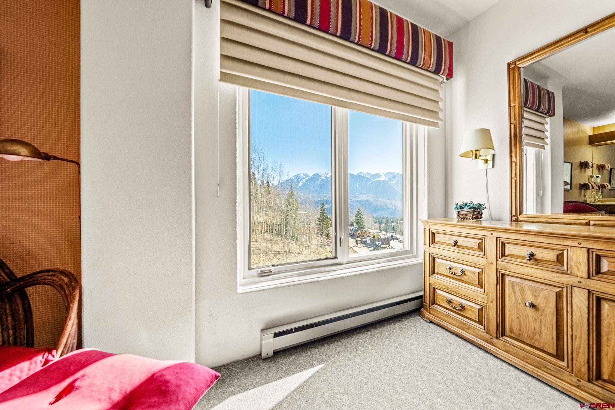 117 Needles Way, Unit 528 Durango, CO 81301 - Photo 9 of 41 a view of a bedroom with window and bathroom