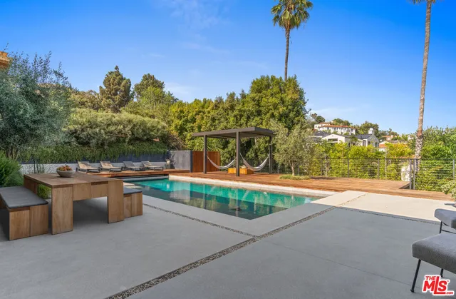 a view of a patio with a table and chairs