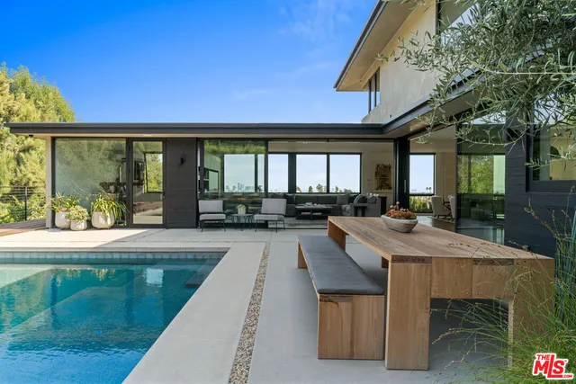 a view of a swimming pool with a patio