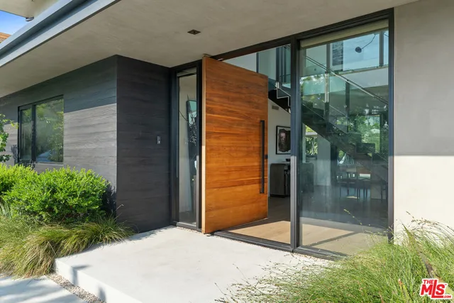 a balcony view with a glass door