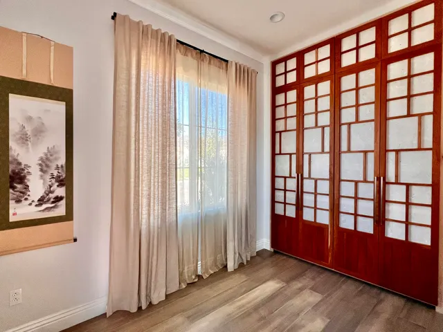 a bathroom with a toilet and a shower curtain