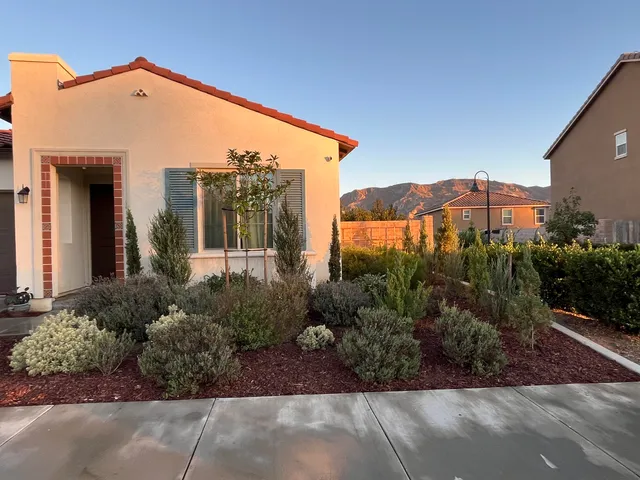 a front view of a building with garden