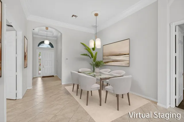 a view of a hallway with furniture and a potted plant