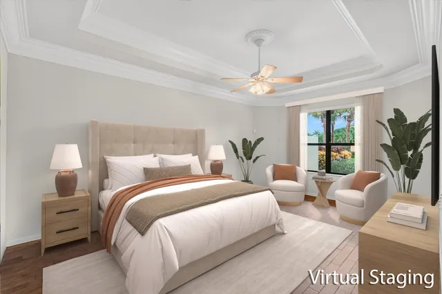 a bedroom with bed a chandelier and a couch