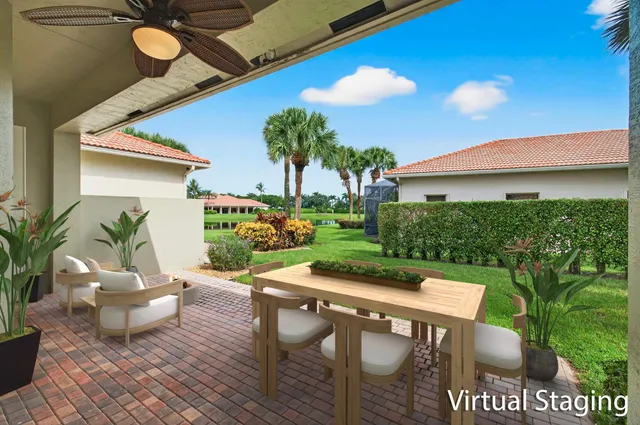 a view of a patio with table and chairs potted plants with wooden floor