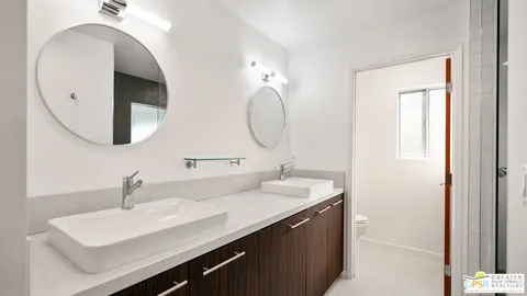 a bathroom with a glass shower door