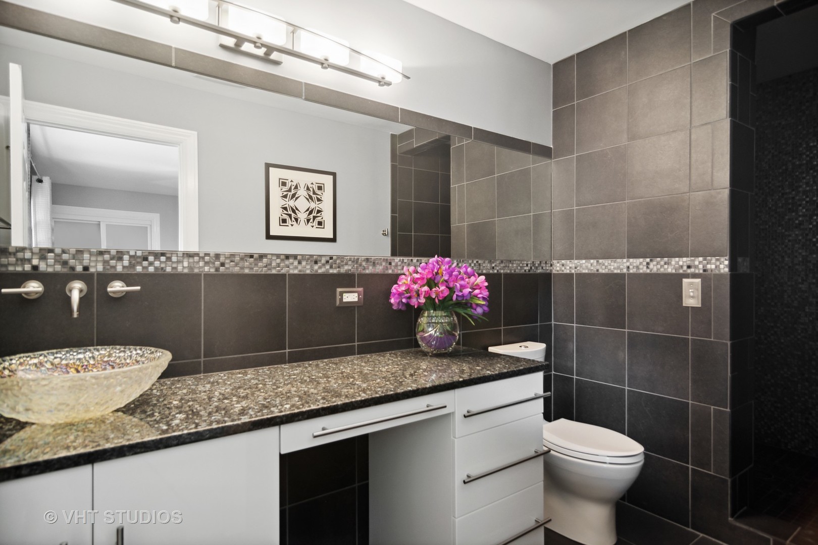 359 Haman Road Inverness, IL 60067 - Photo 20 of 39 a bathroom with a granite countertop sink a toilet a mirror and shower