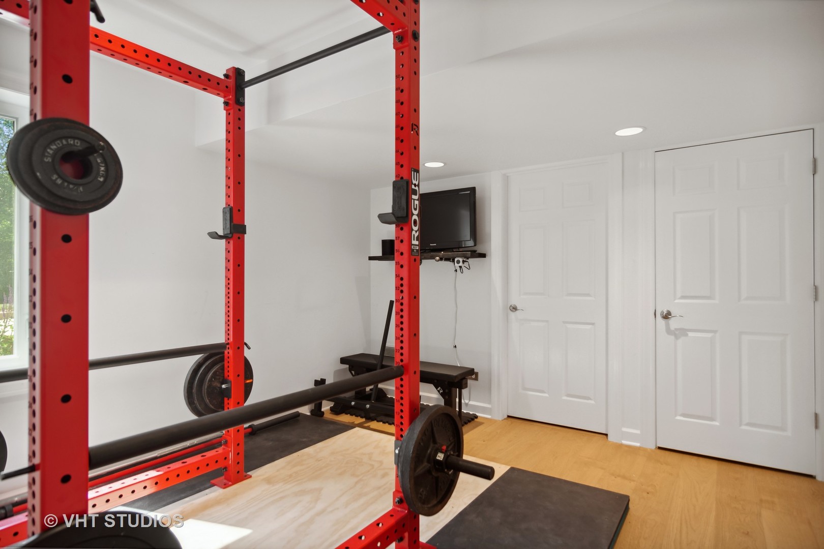 359 Haman Road Inverness, IL 60067 - Photo 29 of 39 a room with gym equipment and a flat screen tv