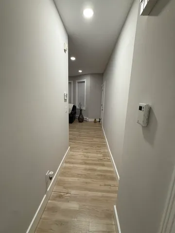 a view of a hallway with stairs