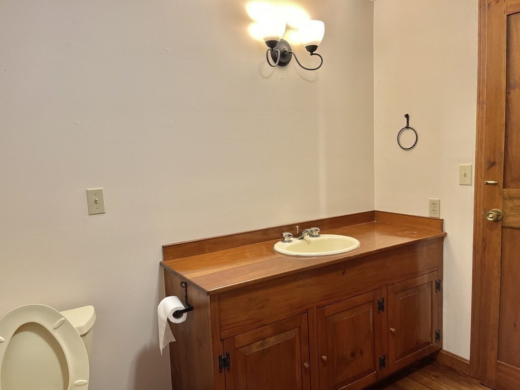 35 John Gilbert Road West Brookfield, MA 01585 - Photo 15 of 35 a bathroom with a granite countertop sink and a mirror
